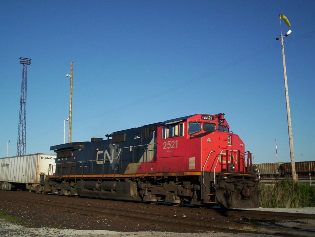 CN's canadian cab Dash9's were always nice to catch here we have Dash9-44CWL 2521 with the evening westbound roadrailer train #145 at Mcgregor road at Sarnia. Notice the old yard light towers were still standing at this time.