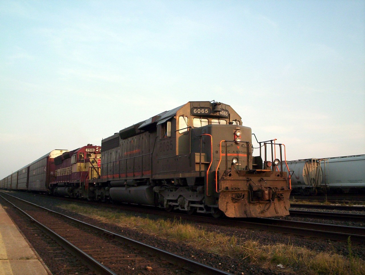 GCFX SD40-3 6065 and WC SD45 7518 pair up with a westbound train of autoracks at Sarnia. These Gec Alsthom leasing SD40's were always great to catch as well as the WC SD45's and they sounded great, far cry from what is out on the mainlines today.