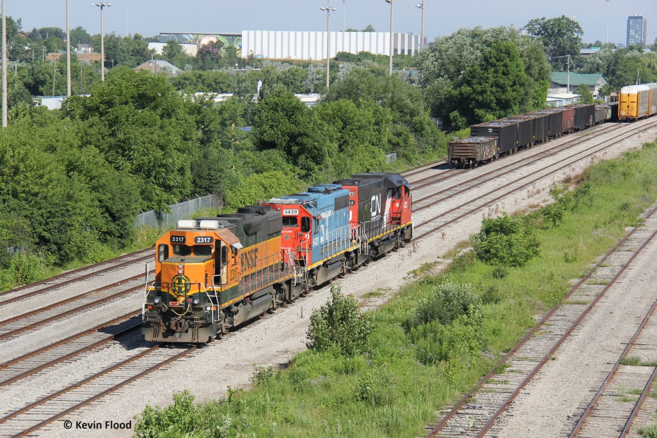 On the morning of July 3, 2024, CN 540 had little work to do at the CN/CP interchange in Kitchener. All the cars in the yard was what is pictured. It was a quick lift of these cars and they headed back to the Guelph Sub. Power was CN 4732-GTW 6420-BNSF 2317 for the northbound run.