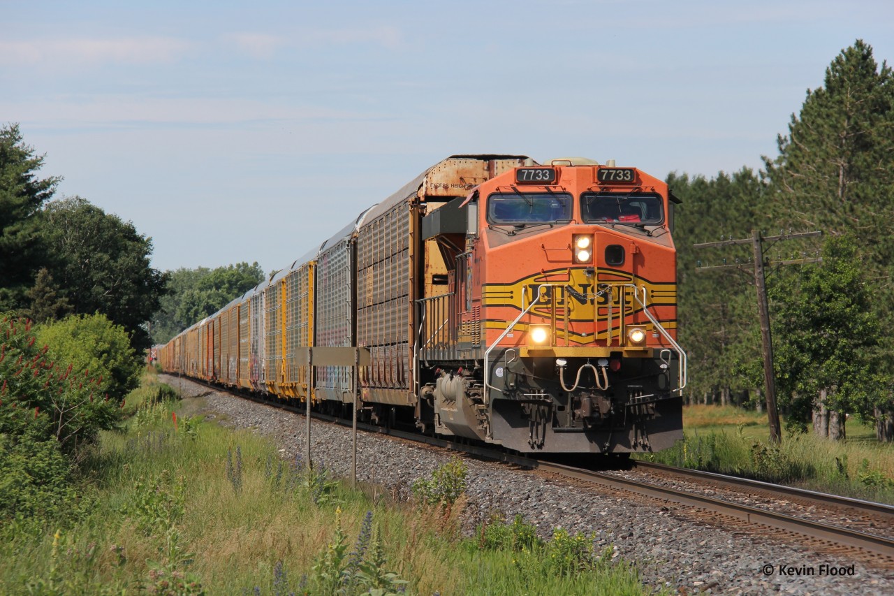 CPKC 734 heads east past Innerkip Highlands Golf Club with solo BNSF 7733. This train would quickly come to a stop at Blandford for unknown reasons. Haven't heard much about 734 these days; it could be because of summer slowdowns in the auto industry.