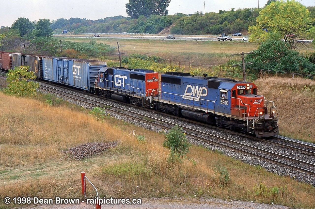 CN Eastbound with DWP SD40 5910 and GTW GP40-2 6422 at Leomonville Rd.