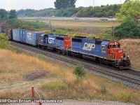 CN Eastbound with DWP SD40 5910 and GTW GP40-2 6422 at Leomonville Rd. 