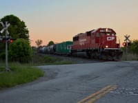 CP SD60 6243 pushes the Weed Sprayer train back south down the Montrose Subdivision at the Biggar and Crowland Road crossing after spraying going north.