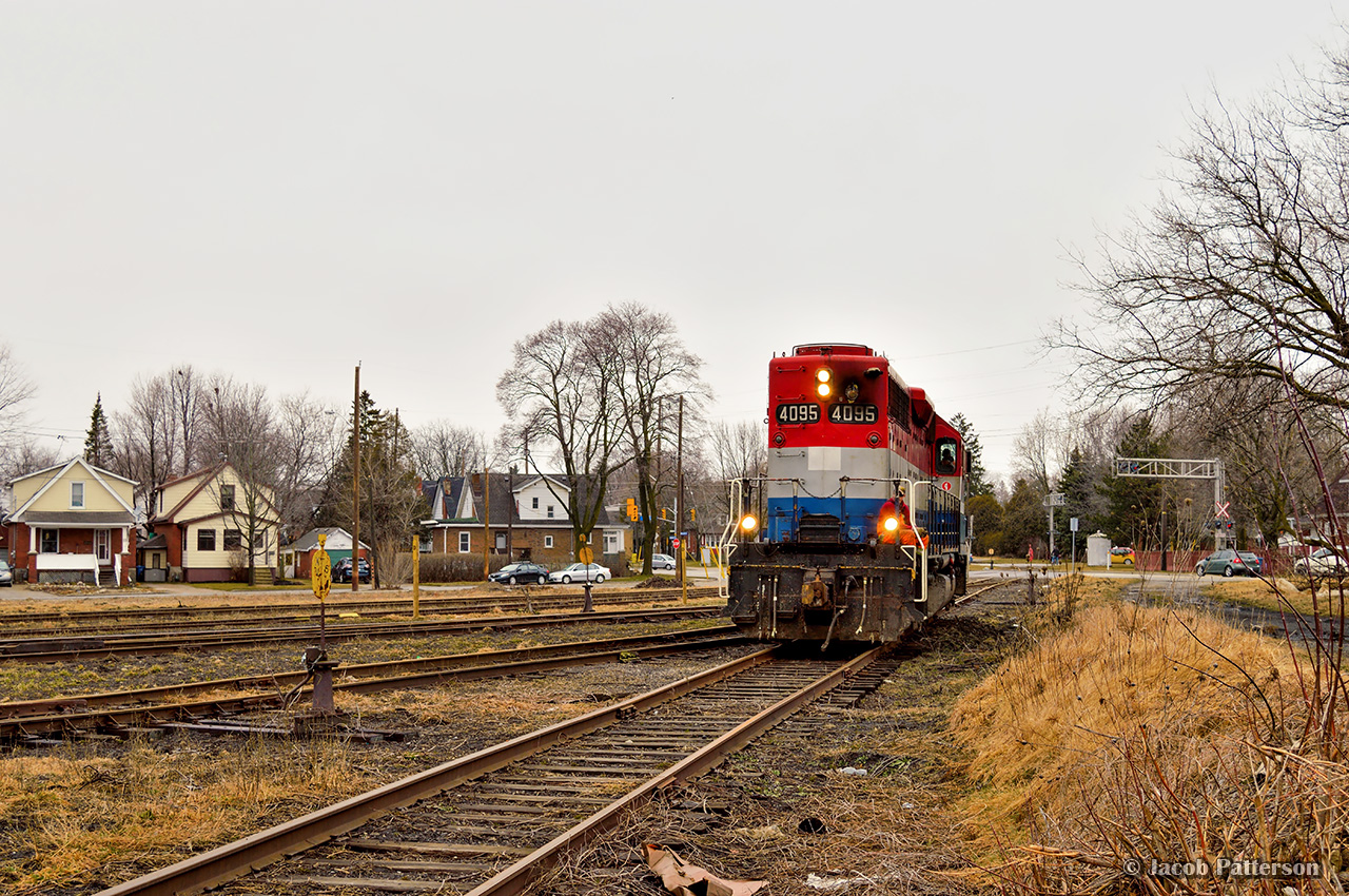 Little colour is to be found on this grey spring day.  GEXR 582 has cut off from their train in XV yard,and is seen heading for the wye.  They will quickly clear the Guelph Sub on the west end of XV yard, allowing VIA 85 to pass while they wait for GEXR 580 to arrive from Kitchener.