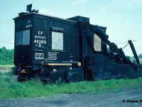 Long stored CP 402851, which is a wooden cab Jordan spreader with ice cutters is pictured sitting in the CP yard at Smiths Falls, Ontario. During the 90's photos show that this spreader spent a significant time in the same location in Smiths Falls. It's final disposition is unknown, unless someone on this site has information on it's eventually status. 
