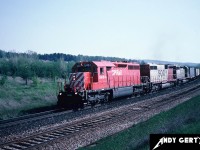 An eastbound CP intermodal train is passing Coakley siding on the Galt Subdivision, east of Woodstock, Ontario. The train is powered by CP SD40 5404, SOO Line SD40B 6450 and SOO Line SD40 6404. 