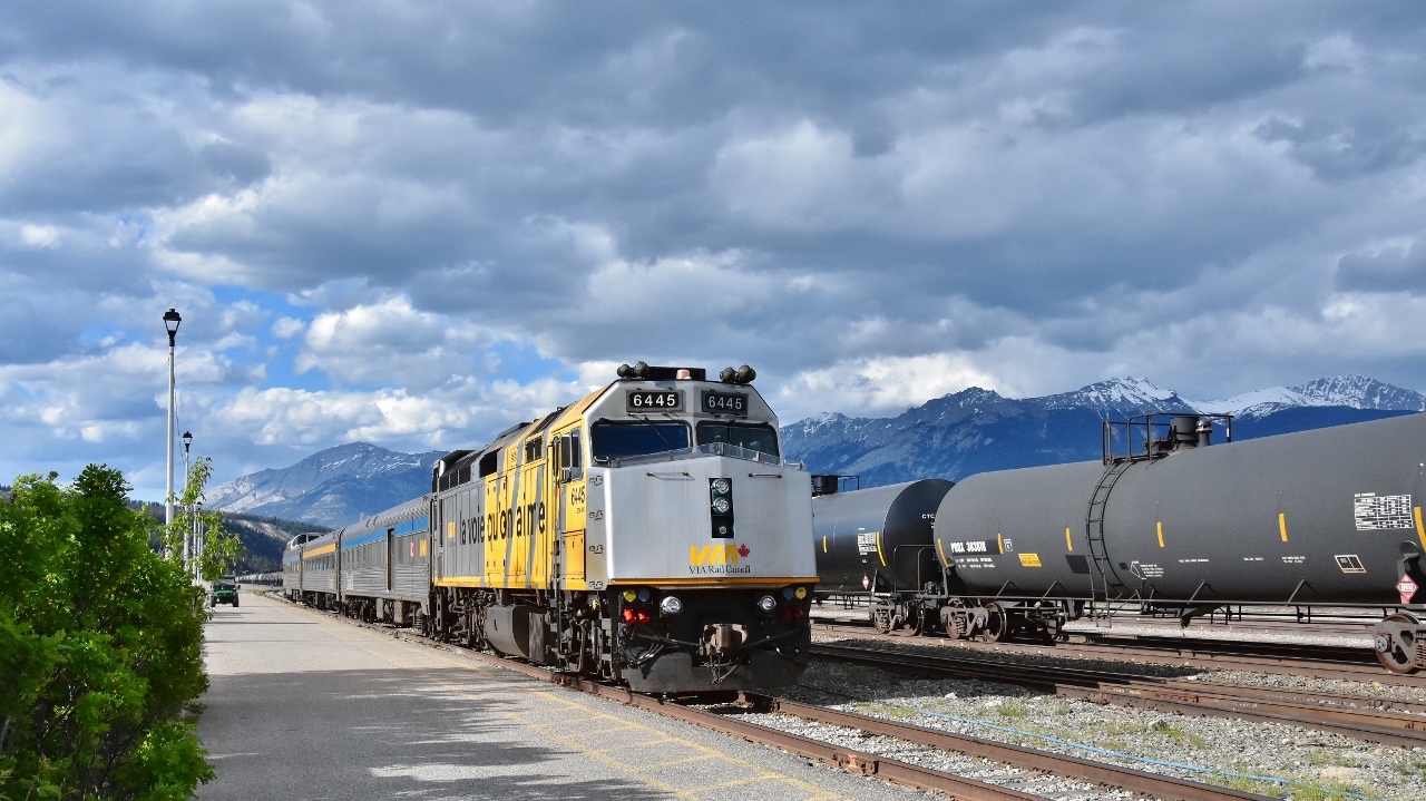 Consist for the June 7 train #5 


6445 

8600
 
8109
 
Banff Park 


at Jasper, June 6, 2024 digital by S.Danko 


noteworthy


Based on the tri weekly scheduling and equipment cycles, it is possible this train set was in Jasper and scheduled to depart Wednesday July 24 at 12:45 MDT. 

Given the evacuation order was issued 10pm Monday July 22, this may have been the train set that was stranded at Jasper during the wild fire (evening of Wednesday July 24).


more:


July 28: There is an unconfirmed report that the VIA train set was moved prior to the wild fire arriving at Jasper:  36 miles east to Swan Landing. 


Further:


July 28: A Globe & Mail reporter (Carrie Tait) – on a controlled  media tour of Jasper -  tweeted that a  VIA train was the Jasper station on the afternoon of July 28. That picture shows the VIA consist (no numbers / names visible):


F40PH facing west

baggage car (ex CP) facing west (baggage room door at west end)

Park car facing east (round end observation coupled to the baggage car)

coach with wide yellow stripe and dark blue paint along the windows), vestibule at at east end.


Possible the F40PH and Baggage were wyed at Swan Landing. 


sdfourty