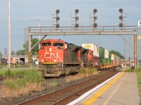 CN SD70M-2 8900 leads train 122 past the station at Sarnia and under the signal bridge, the signals and bridge were installed when the new St. Clair tunnel was opened in 1995 allowing for seamless movements of double stack and over height cars to pass beneath the St. Clair river as seen in this train. 