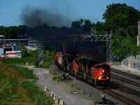 CN 120 has some smokey power (three SD70M-2s and an ES44DC) as it heads east.