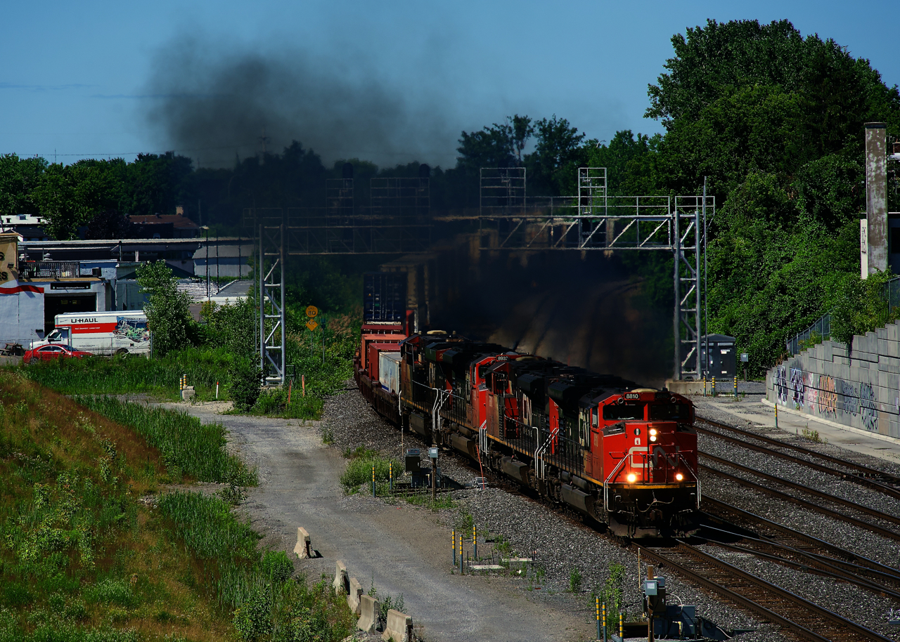 CN 120 has some smokey power (three SD70M-2s and an ES44DC) as it heads east.