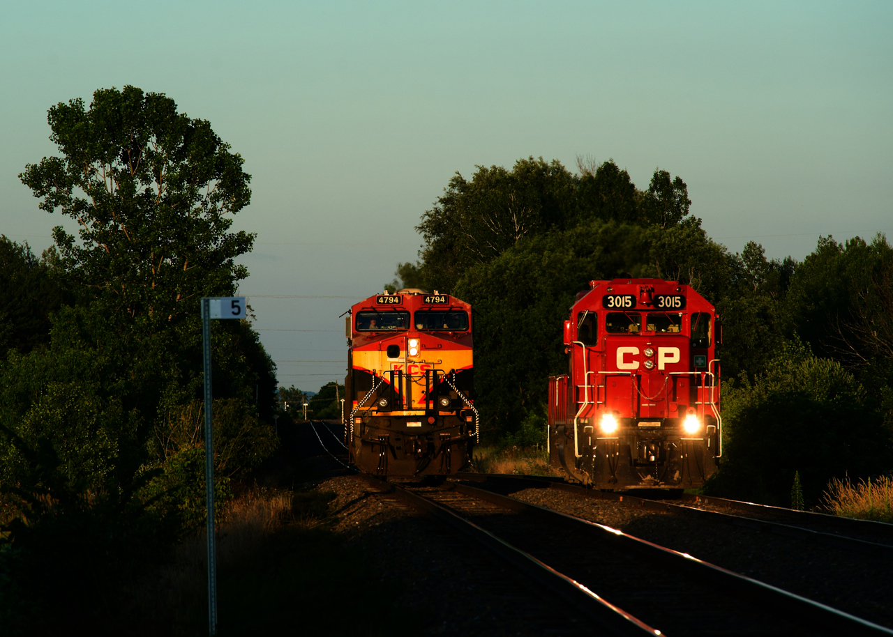 Sunset is about 45 minutes away as CPKC 121's outbound crew is setting CP 3015 off at the yard in Farnham. KCS 4794 at left is the leader and will soon back up to its train before it departs for Montreal.