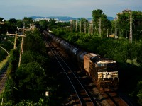 An NS ES44AC brings up the rear of ethanol train CPKC 528.