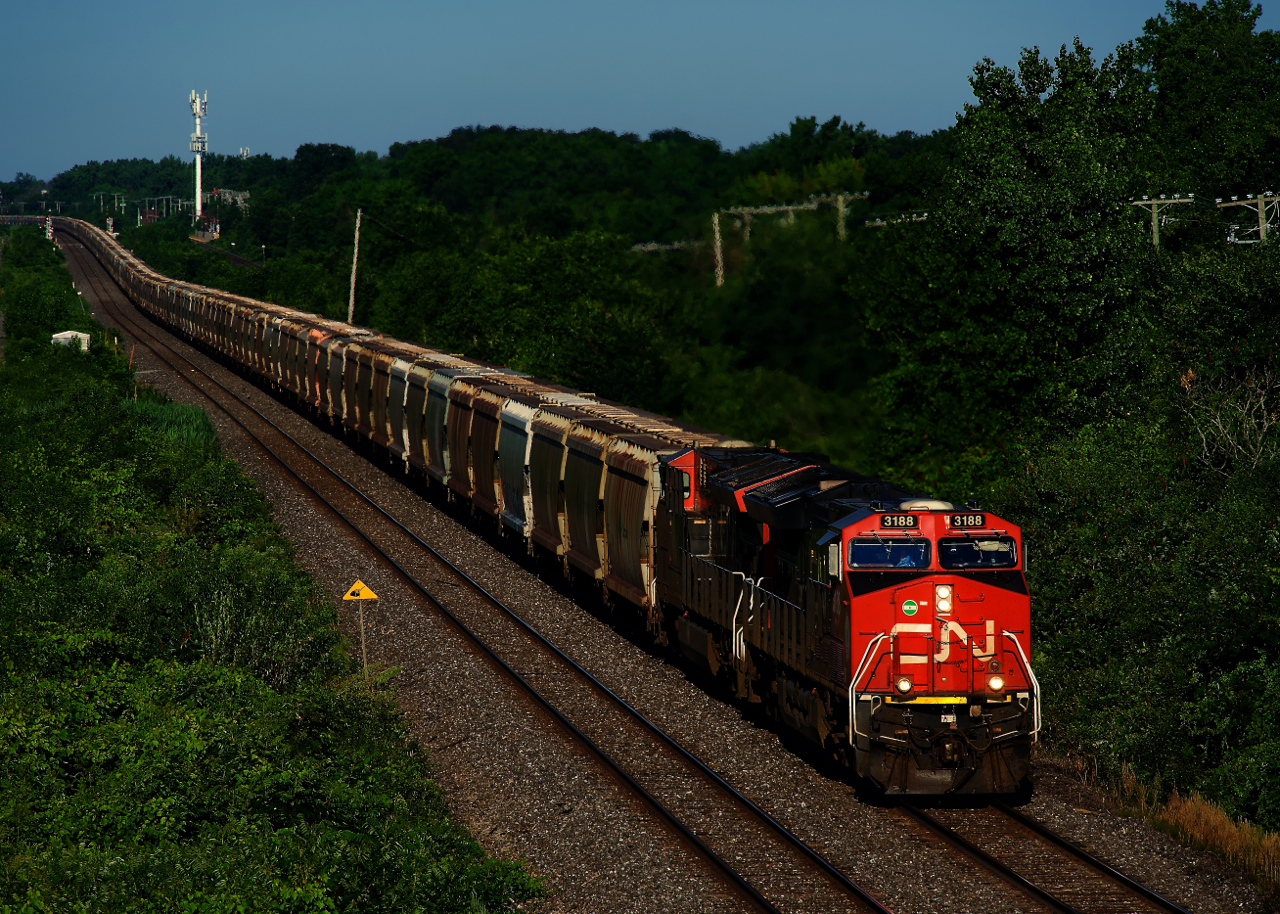 CN B730 has 205 potash loads as it heads east with four GEs spread throughout the train.