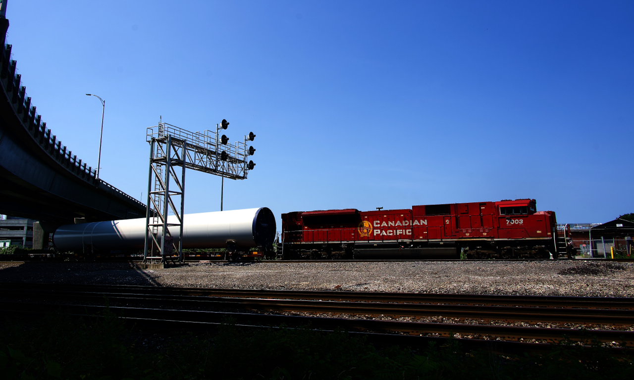 CPKC DIM-924 has CP 7003 solo and windmill parts for Maine as it heads east through Dorval.