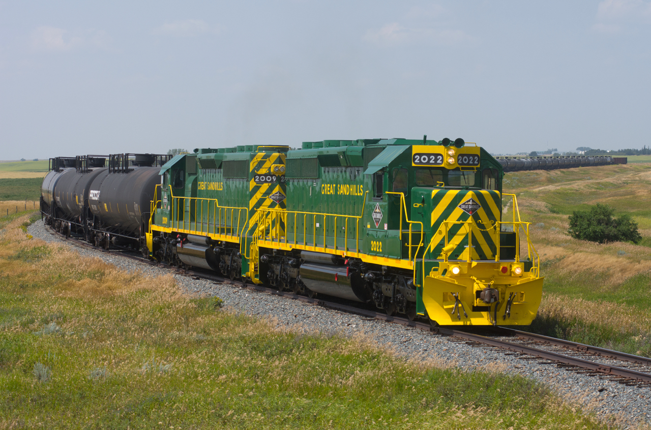 The latest additions to the roster of Great Sandhills Railway slowly make their way toward Swift Current to interchange with CPKC. The sharp looking pair is seen just north of Success, Saskatchewan.