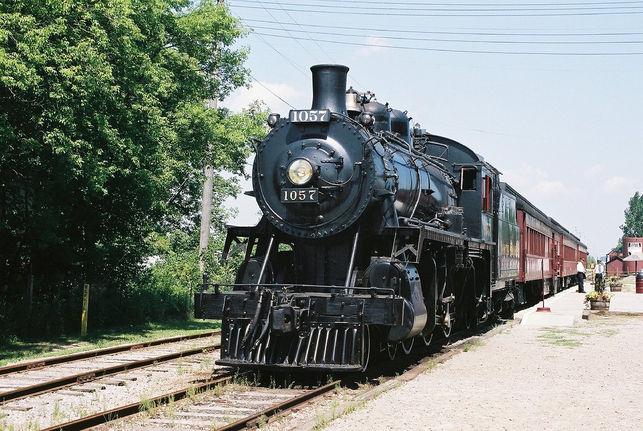 In better times 1057 waits to depart with a Tuesday run. 1057 is out of service with 136 running occasionally. Diesel 703 now handles most excursions. Major firebox work would be required before 1057 could run again. Four generations of my family have rode behind 1057 and 136 starting in 1973. We do our best to support this unique operation, riding or donating every year.