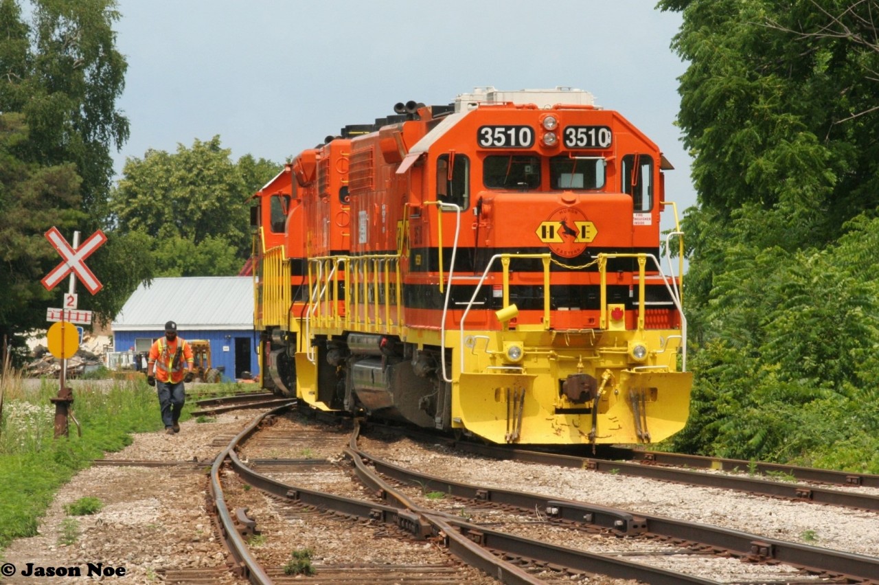 Goderich-Exeter Railway 581 is seen switching out their cars during a humid summer afternoon. The train was powered by HESR 3510 and RLHH 2111 and had arrived earlier with over 20 cars from Stratford. Also, that day the crew had set-off newly re-painted GEXR GP15-1 1533 by the shop.