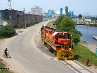 It’s an absolute stunner of a summer day as Goderich-Exeter Railway train 581 is observed completing its switching duties at the picturesque Goderich, Ontario harbor. Powered by veteran GP38-2’s RLHH 2111 and HESR 3510, the train made two runs down to the harbor on this afternoon to lift and set-off sizeable cuts of salt hoppers. While it once ran daily, GEXR 581 is now operating as required to Goderich from Stratford on the Goderich Subdivision. 