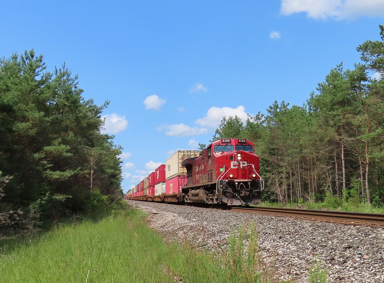 Southbound 112 approaches the Highway 26 crossing with 8578 mid train.