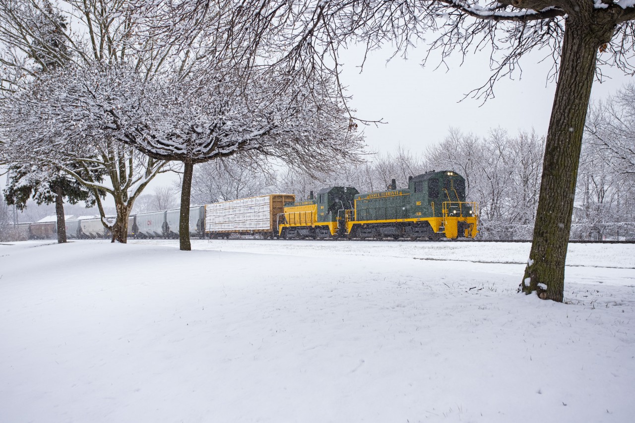 An extra Sunday crew heads for home from Ojibway Yard on a snowy January day. Remember when we had those? The loaded centrebeam is for Border Reload, while the rest of the train will be interchanged to CN on the way back to their Lincoln Road shops. 105 and 104 both are wearing heritage paint schemes of previous Essex Terminal liveries. 105 is particularly cool in that it was delivered brand new to ETR in 1956 wearing this paint scheme.