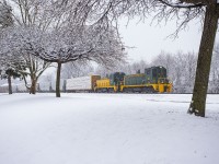 An extra Sunday crew heads for home from Ojibway Yard on a snowy January day. Remember when we had those? The loaded centrebeam is for Border Reload, while the rest of the train will be interchanged to CN on the way back to their Lincoln Road shops. 105 and 104 both are wearing heritage paint schemes of previous Essex Terminal liveries. 105 is particularly cool in that it was delivered brand new to ETR in 1956 wearing this paint scheme. 