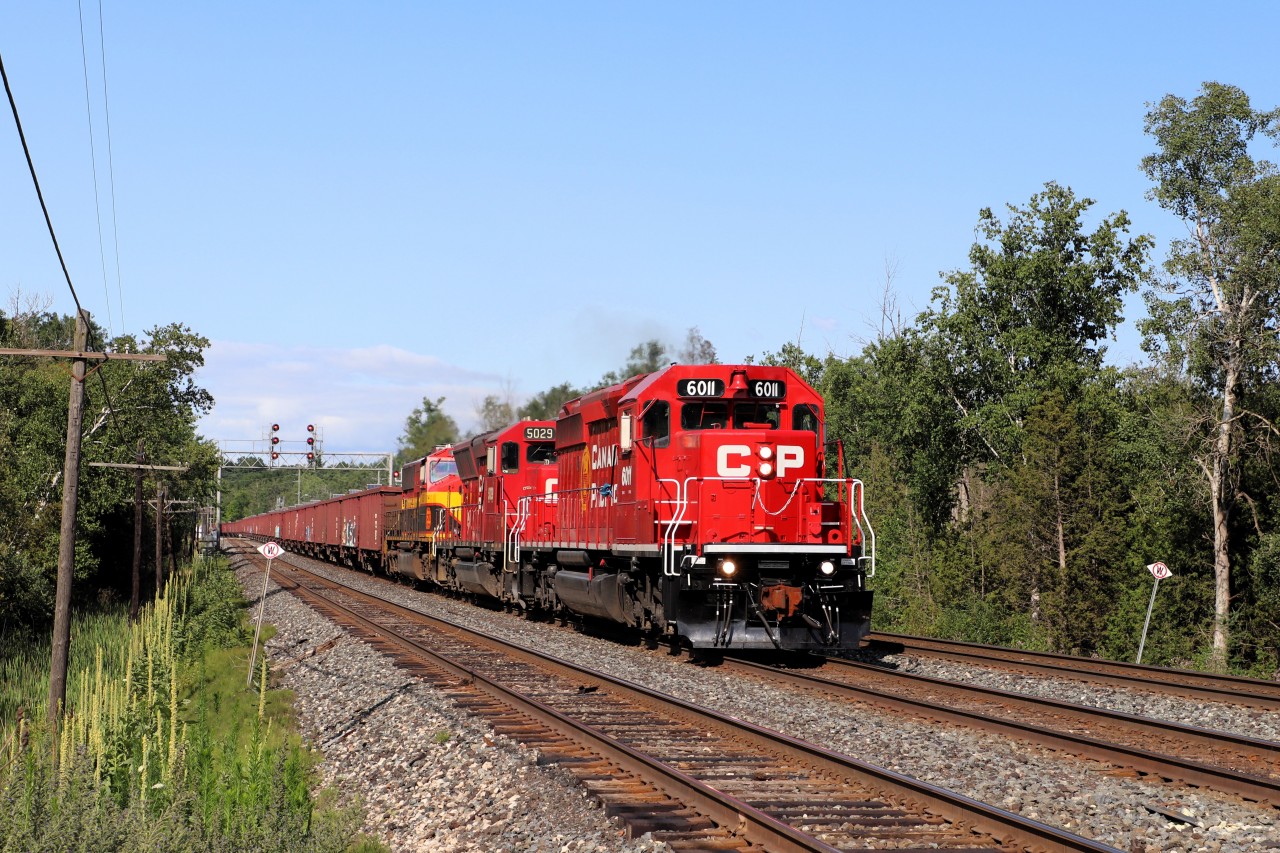 Well the long overdue ballast train finally headed out today to dump ballast along the Galt sub. They had finished dumping by the time they hit Twiss Road in Campbellville. Flying by are SD40-2, CP 6011 all decked out in a new paint job, SD30C-ECO, CP 5029 and SD40-3, KCS 3137. The former CN 5117 was sold to KCS in 1998 and rebuilt in to its current KCS 3137 SD40-3 style. The trio would wye their train at Guelph Junction and head back east to Lambton.