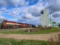 BCOL 4642 leads CN A 41851 30 past the old wooden elevator at Dapp, Alberta on the former Northern Alberta Railway mainline to the Peace River. 