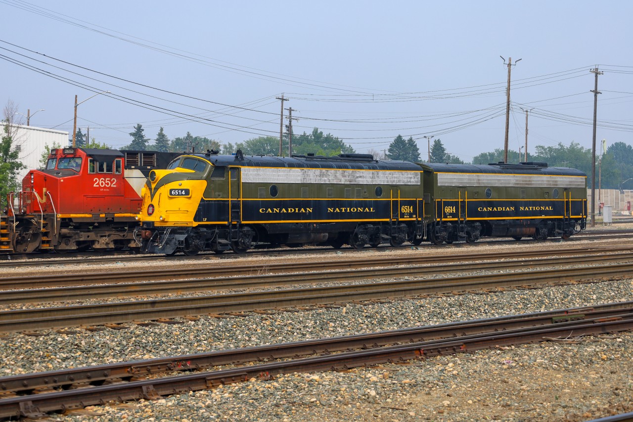 CN 6514 and CN 6614, sit outside of the Walker Yard LRC on a smoky July afternoon.  These locomotives came from the Alberta Railway Museum located just north east of Edmonton.