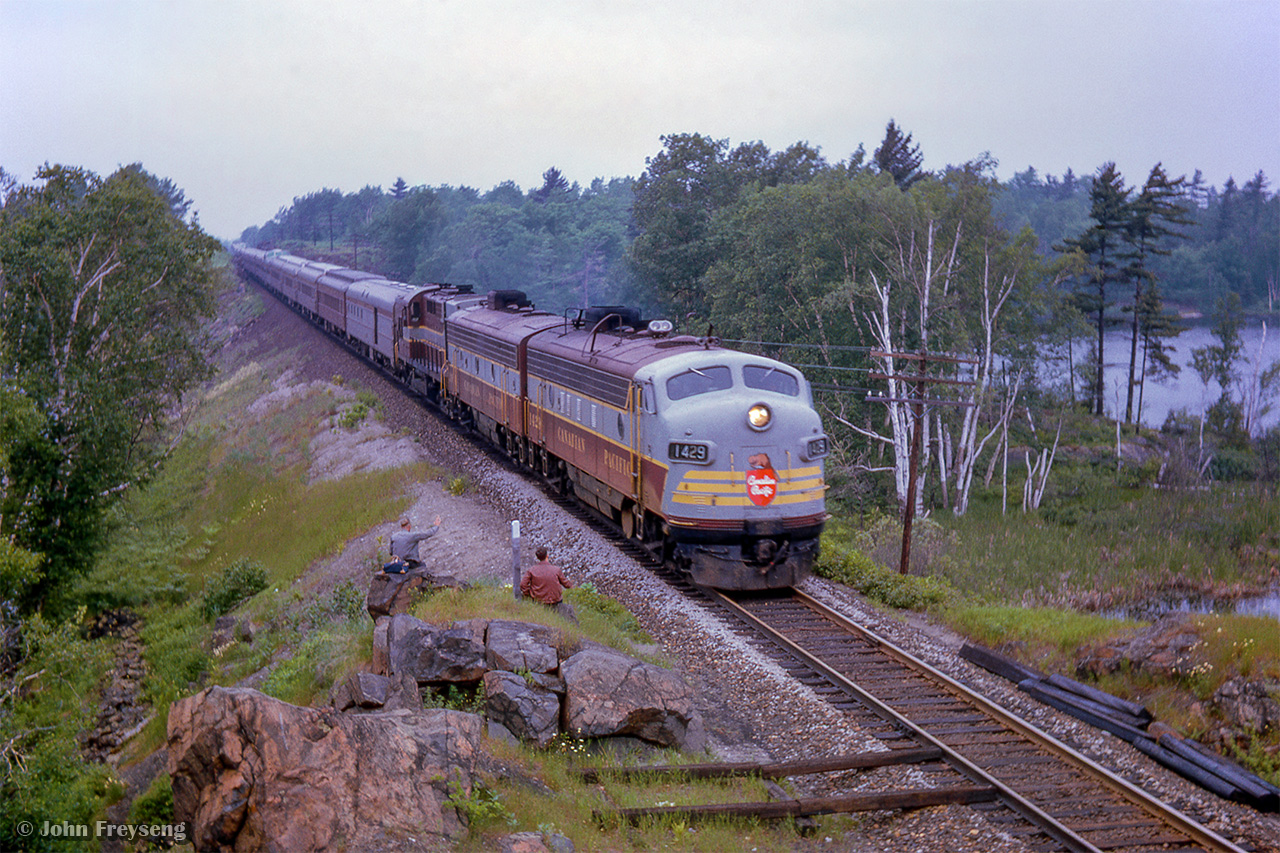 While servicing is taking place on CNR 6167 at nearby CN South Parry, the turnaround point on todays excursion, CPR 12, the Sudbury - Toronto section of the Canadian, cruises south past a few photographers.

I had been working the lunch counter on this UCRS excursion, and had the opportunity to get the following shots throughout the trip:
Northbound over the Trent-Severn Waterway at Washago
Southbound over the Trent-Severn Waterway at Hyro Glen


Scan and editing by Jacob Patterson.