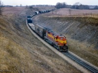 Lake Superior & Ishpeming 1803, and ALCO RSD12 on lease to the CPR, leads an eastbound timetable freight downgrade just east of Orr's Lake through Barrie's Cut.<br><br><i>Scan and editing by Jacob Patterson.</i>