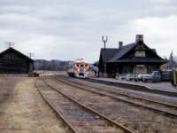 A pair of Ottawa-bound CPR dayliners running as Saturday only train 137 pause at Montebello, Quebec.  This log station, constructed in 1931, replacing an earlier structure.  Serving its last train in 1981, the station was relocated to main street in 1989 where it now serves as a tourist information centre.<br><br><Scan and editing by Jacob Patterson.</i>