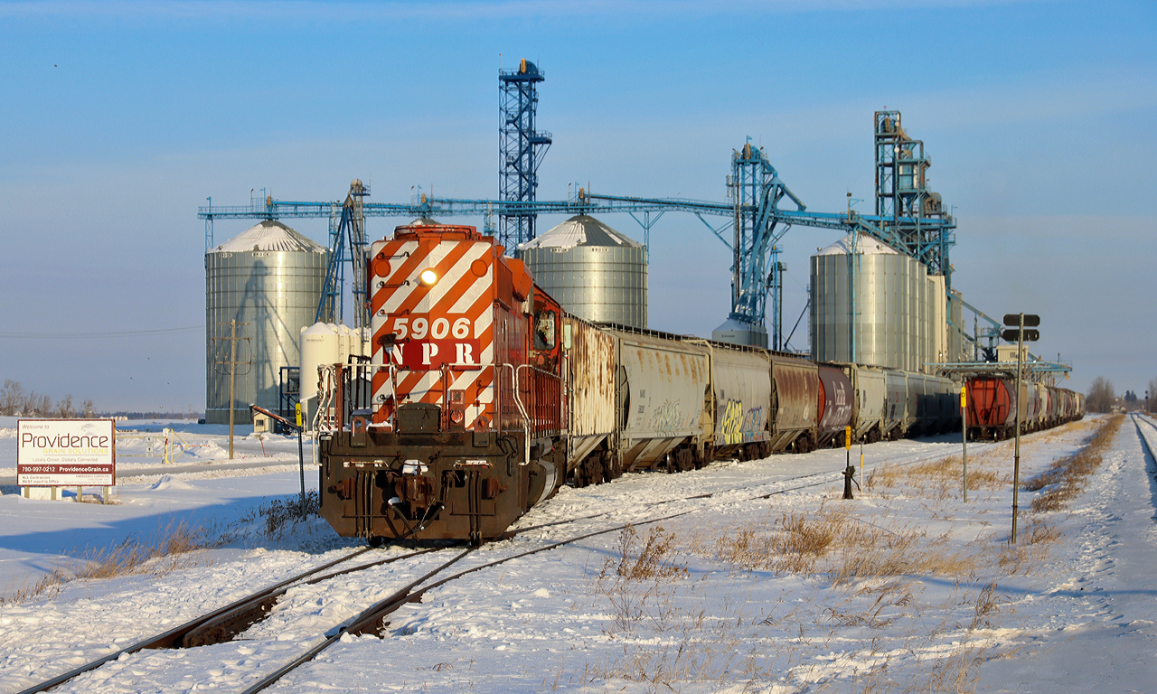 The resident switcher at the Providence Grain Gaudin elevator, located off CN's Vegreville Sub just east of Scotford is Northern Plains Rail Services SD40-2 NPR 5906. (ex CP 5906).  Seen here moving cars through the loading track.