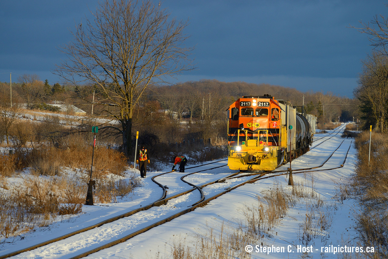 Branchline railroading is in effect as GEXR 583 has arrived at Arkell, the crew is setting the switch and tossing the derail off to pull ahead and duck into the siding, 582 is coming and both crews decided to meet here. Back when this job ran north every day in the evening they had to meet somewhere and every siding between the Junction and Guelph was used for meets. I don't know what possessed me to go out, but the lighting I found  which Steve Danko commented about and rightfully so, possessed me to chase it north. It was absolutely drop dead gorgeous. All I can say is there was a break to the north,and dark clouds to the south, and the sun had broke through as it was nearly sunset. As I traveled with the train north the light got a little less dark as the clouds would eventually no  longer be to my north as I waited for this meet to happen, but this lighting effect in winter I'd never seen before and never seen since. It was absolutely phenomenal. Usually with this kind of thing in summer/spring you'd get the bright red/orange cloud effect. Not this day. Just very strange probably due the height of whatever clouds these were - fairly low compared to the usual likely due to a low dewpoint (just my guess).