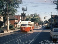 TTC PCC 4097 (part of the original A1-class order of TTC PCC's built by CC&F in 1938-1940) heads southbound on Roncesvalles Avenue at Fern Avenue on an eastbound King streetcar run on a sunny July morning in 1965. Various small shops mix with residential houses along the street, advertising for such things as CIL paints and IDA Drugs.<br><br>At the time, eastbound King cars departed Vincent Loop (the off-street loop east of Dundas & Edna, pre-Dundas West Subway Station), headed down Dundas and Roncesvalles (shown here) to the Sunnyside area, took King Street east from Queen to Broadview Avenue, and Broadview up to Erindale Loop at Broadview & Erindale Ave. A few months later, service to Erindale Loop would end and be replaced by the new Broadview Subway Station's loop on the under-construction Bloor-Danforth subway line. Vincent Loop would be replaced in February by the new <a href=http://www.railpictures.ca/?attachment_id=51391><b>Dundas West Subway Station</b></a> loop.<br><br><i>James L. Alain photo, Dan Dell'Unto collection slide.</i>