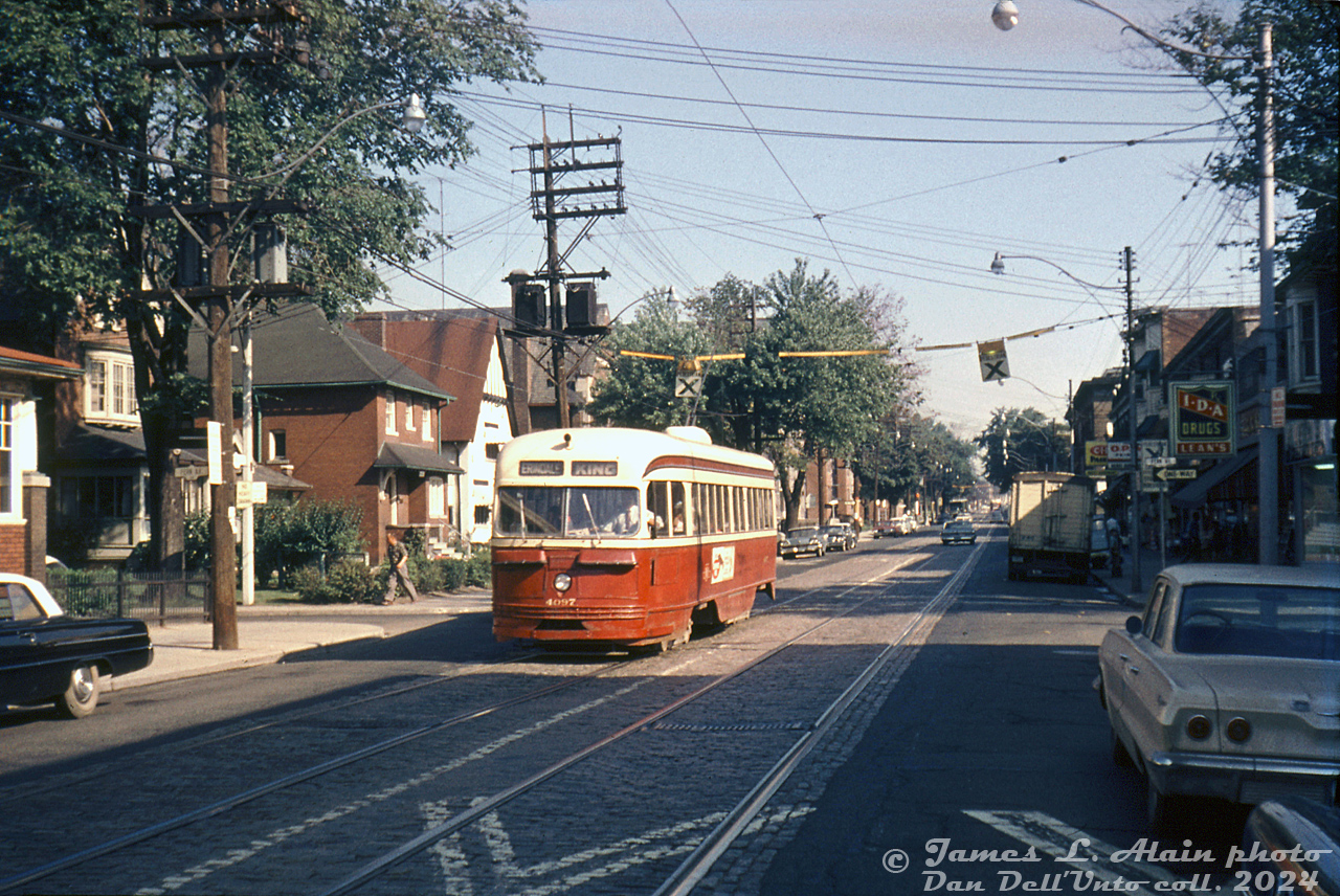 TTC PCC 4097 (part of the original A1-class order of TTC PCC's built by CC&F in 1938-1940) heads southbound on Roncesvalles Avenue at Fern Avenue on an eastbound King streetcar run on a sunny July morning in 1965. Various small shops mix with residential houses along the street, advertising for such things as CIL paints and IDA Drugs.

At the time, eastbound King cars departed Vincent Loop (the off-street loop east of Dundas & Edna, pre-Dundas West Subway Station), headed down Dundas and Roncesvalles (shown here) to the Sunnyside area, took King Street east from Queen to Broadview Avenue, and Broadview up to Erindale Loop at Broadview & Erindale Ave. A few months later, service to Erindale Loop would end and be replaced by the new Broadview Subway Station's loop on the under-construction Bloor-Danforth subway line. Vincent Loop would be replaced in February by the new Dundas West Subway Station loop.

James L. Allen photo, Dan Dell'Unto collection slide.