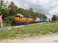 CN 568 heads west out of Kitchener just east of Petersburg with BNSF 2317-GTW 6420-CN 4910, dubbed “the trio” by Kitchener Watch. Like BNSF 2090, the 2317 has already spent a good amount of time in the Kitchener pool, arriving on the scene in late June. If only the BN green units (2926, 2098) would spend some time in lead position up here. Here is a similar lashup caught by Steve in September 2023: http://www.railpictures.ca/?attachment_id=52943. Interestingly, all the paint schemes are almost identical but the engine numbers are different!