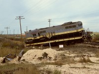 On the west side of Grande Prairie, 108th Street carrying Highway 40 crossed Northern Alberta Railways at mileage 50.91 of the Grande Prairie subdivision heading west to Dawson Creek.  From the debris seen there on Monday 1978-09-25 with GP9 202 rather uncomfortably parked and the scattered remains of a loaded woodchip truck which had experienced a rapid unscheduled disassembly, it appeared that the Dawson Creek wayfreight train No. 51 on the preceding Friday did not reach its destination.  That crossing was notorious for such collisions.