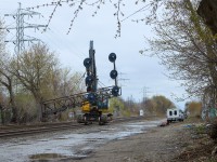 Ever chased signals before? After torching the cantilevers at Howland...work crews from ETS Tree Removal drove their hi-rail excavator or "Railavator" a mile and a half west to Bartlett Ave where they would set the searchlights onto the ground upright before clearing off the main to let a backlog of trains through.

After seeing this spot the other night without the signals...it really hits home how much of a difference lineside infrastructure makes. It's just not the same anymore, I don't know what else to say. It sucks. And this is only the beginning, you can kiss all the rest of the searchlights goodbye, just give it time. Nothing lasts so, enjoy it while you can and take all the photos you can. Take nothing for granted.