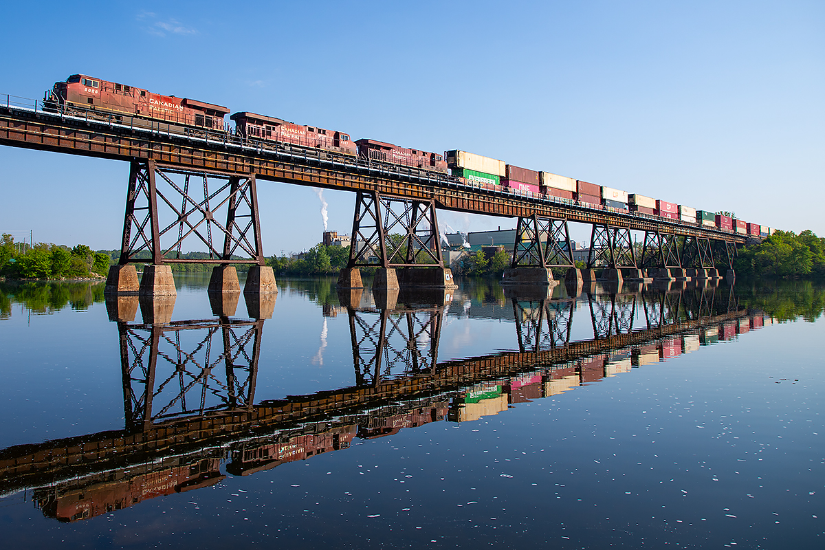 CPKC 113 is the last of the overnight westbound "rush" on the Belleville Sub as it crosses the Trent River, soon giving way to a handful of daytime eastbound trains.