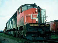 During a hazy summer evening, CN 421 with HR616 2115 and M-636 2328 are pictured working the Kitchener Yard on the CN Guelph Subdivision. According to my slides, the crew is lifting a GP9RM out of the yard to take west with them. Unfortunately, I didn’t record the number of the GP9RM at the time. 