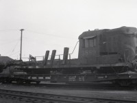 Not many pictures exist of CN 3889.  CN 3889 was the lead unit on an eastbound freight that was struck head on by a couple locomotives that were set in motion from the shop track at Foleyet, Ontario by individuals unknown on April 5th, 1964.  The point of impact was at mile 3 of the Oba Sub.  The remains of 3889 were sold to the Pacific Great Eastern Railway for parts.  However, there does not appear to be many useful parts so I hope they didn't pay too much!