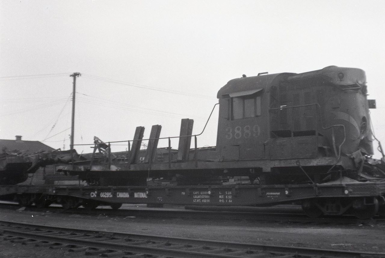 Not many pictures exist of CN 3889.  CN 3889 was the lead unit on an eastbound freight that was struck head on by a couple locomotives that were set in motion from the shop track at Foleyet, Ontario by individuals unknown on April 5th, 1964.  The point of impact was at mile 3 of the Oba Sub.  The remains of 3889 were sold to the Pacific Great Eastern Railway for parts.  However, there does not appear to be many useful parts so I hope they didn't pay too much!