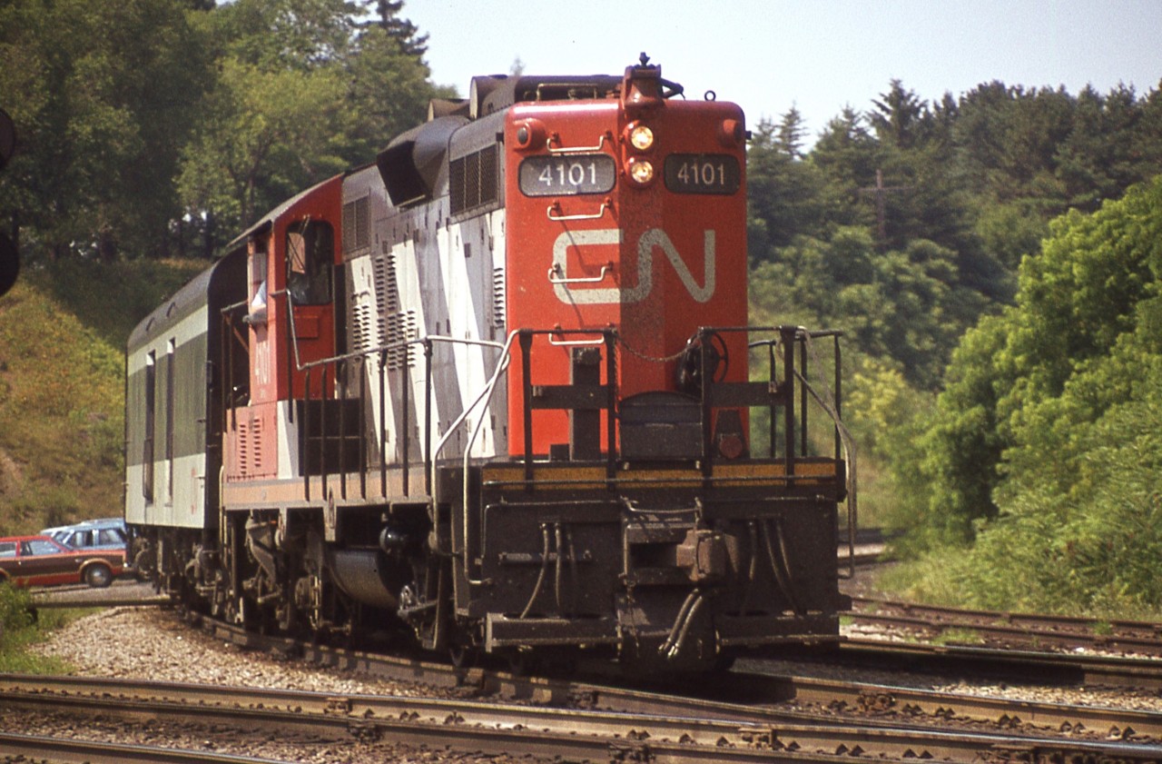 Early days of VIA....this appears to be just an ordinary CN passenger train, but slowly some equipment was receiving the new blue and gold colours.
CN 4101 is seen in a tight view just about to enter the Oakville Sub at Bayview Jct in what appears to be early afternoon setting. 
The 4101 eventually was dealt off to the Pioneer Rail Corporation in 2003.