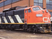  Here's an image of CN 9165, sitting by the shop building in Fort Erie. One would thin being now mid-March, its snow fighting duties are over for another year. Those big shields to keep the snow out of the engine compartments were quite distinctive. I don't know how many were equipped this way but I do recall 9178 at Stratford was another.
This unit was eventually sold to National Railway Equipment.