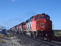 CN 9518 leads a pair of SD40s over the north switch at Suez, Ontario on August 11th, 1986.  The second unit, 5002, is from CN's first order of SD40s with dynamic brakes.  The third unit is 5135.  They were making good time with only about 3 miles to go before reaching Capreol.