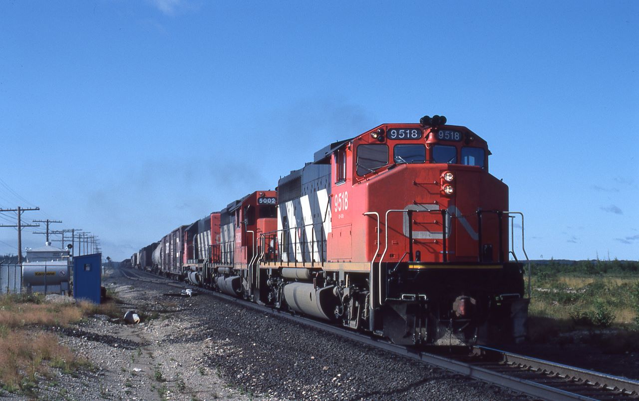 CN 9518 leads a pair of SD40s over the north switch at Suez, Ontario on August 11th, 1986.  The second unit, 5002, is from CN's first order of SD40s with dynamic brakes.  The third unit is 5135.  They were making good time with only about 3 miles to go before reaching Capreol.