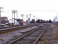 Yes, I realize this is a rather rough image, but it is of interest to the Niagara folk. Once upon a time there was a lot of activity along the Grimsby sub; with all the fruit harvests and related business. Believe it or not, I am standing between the tracks and Railroad Ave (or street?) at Winona Road crossing looking west and there is a freight coming. But look at the other activity!!

 Of course everything today is gone save for the main line. Even the old house on the left.  Its a shame.  So there you have it. Back then, even Winona had a rail yard.
  The station, which would have been to my left about 200 ft down the line, burned down in this time frame. No idea what caused the blaze.
