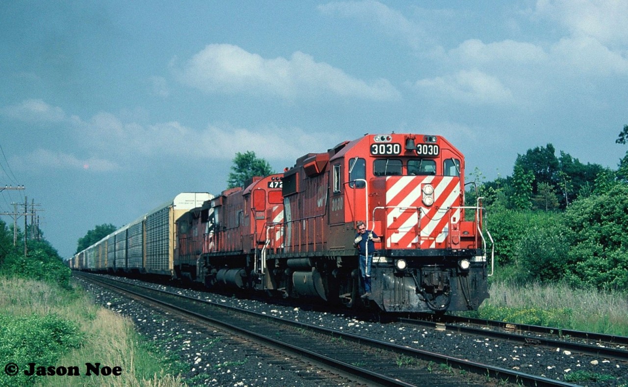 During a hot summer evening a westbound CP train is seen in the siding at Orrs Lake, Ontario on the Galt Subdivision preparing to meet an eastbound. This consist was quite wild even by mid-90’s standards as it included GP38-2 3030, M-636 4721 and GP35 5012. While seeing a big MLW still in operation was awesome, which had now been given a blanked-over cab during reactivation at St-Luc, the real draw was GP35 5012. At the time, the entire fleet of CP GP35’s were assigned to Western Canada and one straying this far east was very un-common. Even in all my trips to CP’s Toronto Yard diesel shop, I never photographed or saw another one after this. 

M-636 4721 ran for almost one more year before it was “re-retired” on July 5, 1995. While on August 2 ,1996 GP35 5012 was released from CP’s Weston Shops after conversion to control cab-daughter slug 1125. It was mated with GP38-2 ‘mother’ 3035 and assigned to Winnipeg. It was ultimately retired in October 2012.