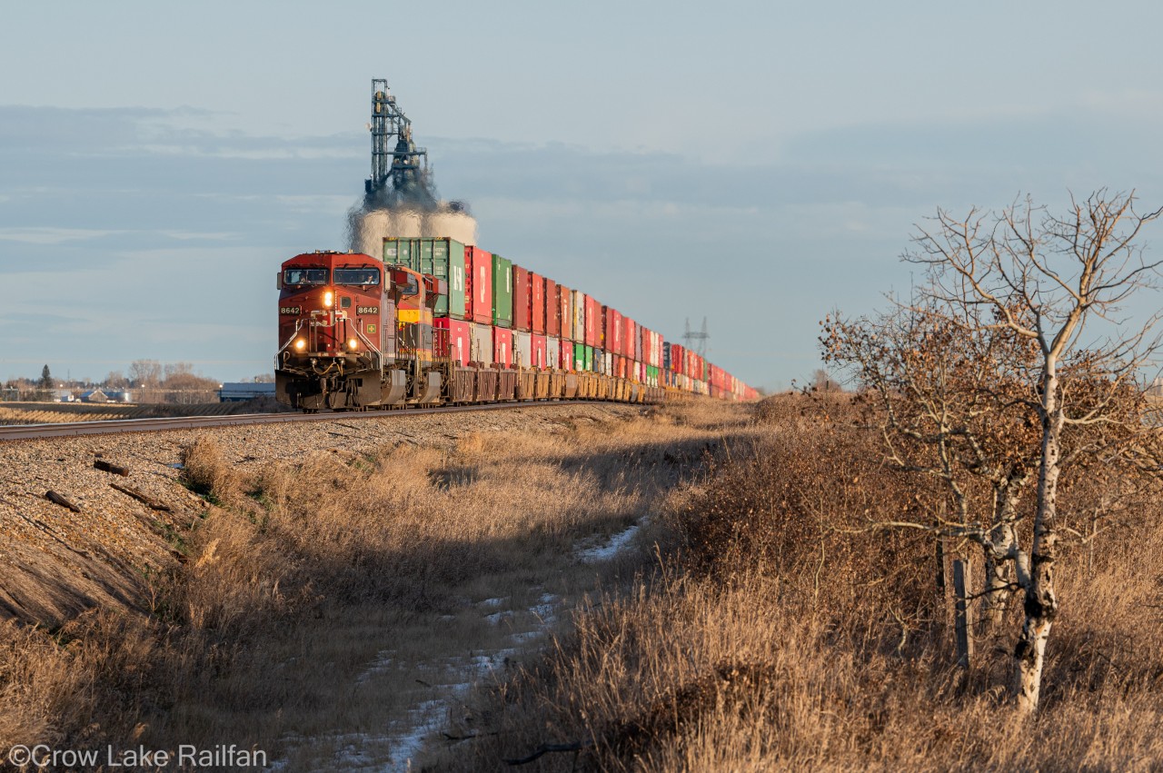 The crisp November air is broken by the faint whistle of CP train no. 119 at Indus. It's hustling west into the sunset for a crew change at Alyth, CPKC's main yard in Calgary, Alberta.