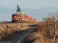 The crisp November air is broken by the faint whistle of CP train no. 119 at Indus. It's hustling west into the sunset for a crew change at Alyth, CPKC's main yard in Calgary, Alberta.